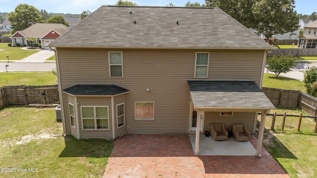 433 Shepherd Trl, Aberdeen, NC 28315 - rear view of house with a patio, a fenced backyard, a shingled roof, and a gate