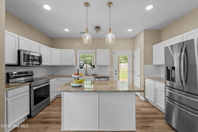 433 Shepherd Trl, Aberdeen, NC 28315 - kitchen featuring appliances with stainless steel finishes, white cabinets, backsplash, a center island, and recessed lighting