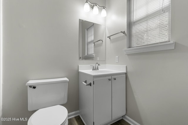 219 Live Oak Ct, Midway Park, NC 28544 - bathroom featuring toilet, vanity, baseboards, and wood finished floors