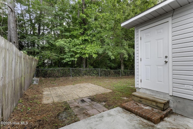 219 Live Oak Ct, Midway Park, NC 28544 - fenced backyard with entry steps and a patio