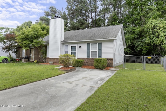 219 Live Oak Ct, Midway Park, NC 28544 - view of front facade with brick siding, roof with shingles, a chimney, a gate, and concrete driveway