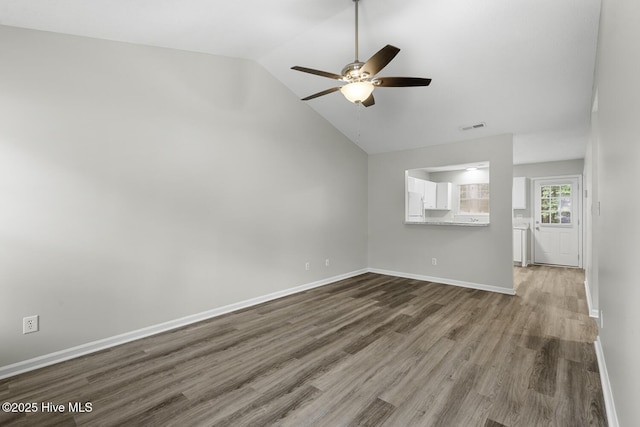219 Live Oak Ct, Midway Park, NC 28544 - unfurnished living room featuring wood finished floors, a ceiling fan, lofted ceiling, and baseboards