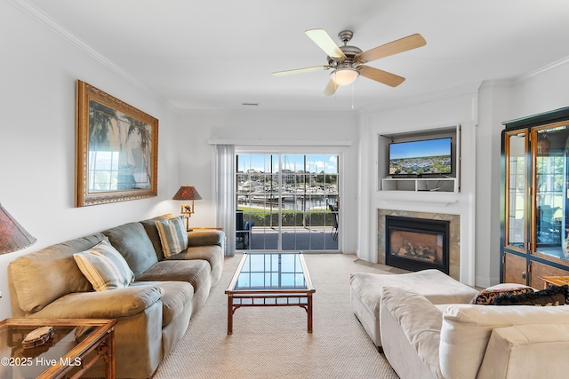 2555 St James Dr SE Unit 102, Southport, NC 28461 - living area with carpet floors, ornamental molding, ceiling fan, and a tiled fireplace
