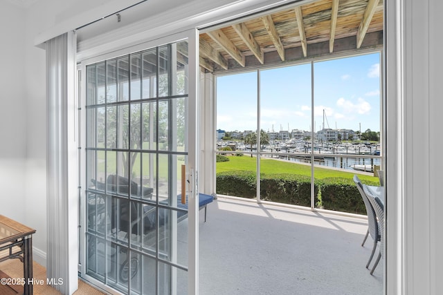 2555 St James Dr SE Unit 102, Southport, NC 28461 - doorway to outside featuring a water view and view of marina