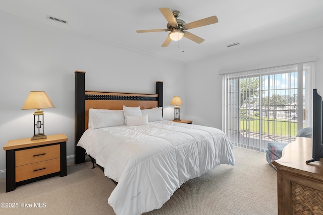 2555 St James Dr SE Unit 102, Southport, NC 28461 - bedroom featuring light colored carpet, access to exterior, ornamental molding, and ceiling fan