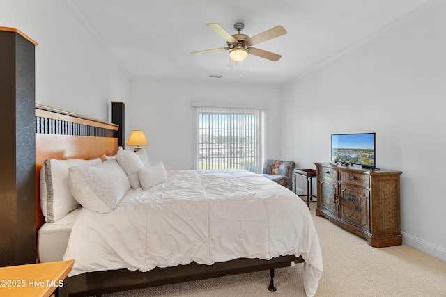 2555 St James Dr SE Unit 102, Southport, NC 28461 - bedroom featuring light colored carpet, ornamental molding, baseboards, and a ceiling fan