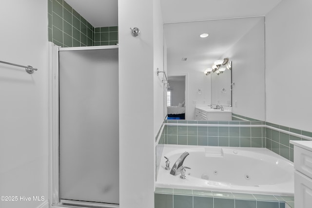 2555 St James Dr SE Unit 102, Southport, NC 28461 - bathroom with vanity, a shower stall, and a tub with jets