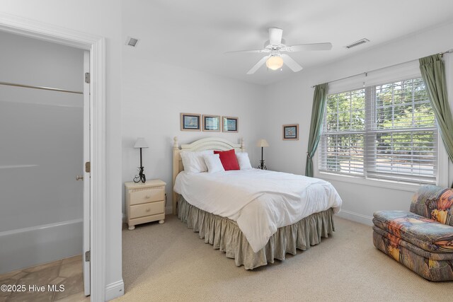 2555 St James Dr SE Unit 102, Southport, NC 28461 - bedroom featuring light colored carpet, baseboards, and ceiling fan
