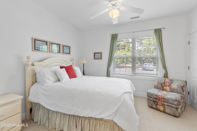 2555 St James Dr SE Unit 102, Southport, NC 28461 - bedroom featuring carpet flooring, baseboards, and a ceiling fan