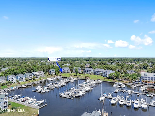 2555 St James Dr SE Unit 102, Southport, NC 28461 - aerial view of a marina, a nearby body of water, and a tree filled landscape