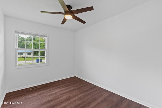 515 Brynn Marr Rd, Jacksonville, NC 28546 - empty room with dark wood finished floors, a ceiling fan, and baseboards