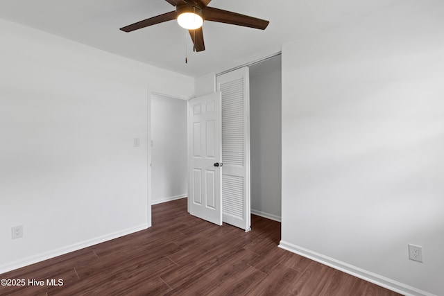 515 Brynn Marr Rd, Jacksonville, NC 28546 - unfurnished bedroom with a closet, dark wood-style floors, baseboards, and a ceiling fan