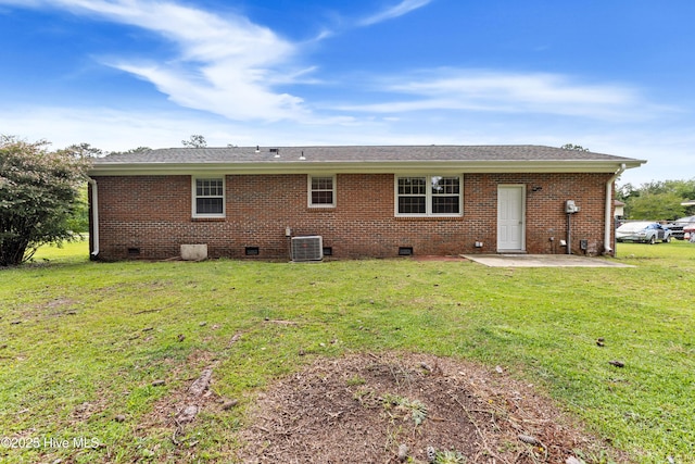 515 Brynn Marr Rd, Jacksonville, NC 28546 - back of property with crawl space, a patio, a lawn, central AC, and brick siding