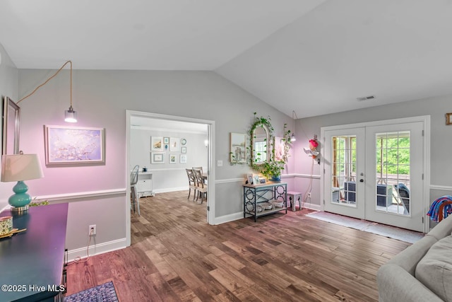 912 Morganser Dr, Swansboro, NC 28584 - living room featuring french doors, lofted ceiling, wood finished floors, and baseboards