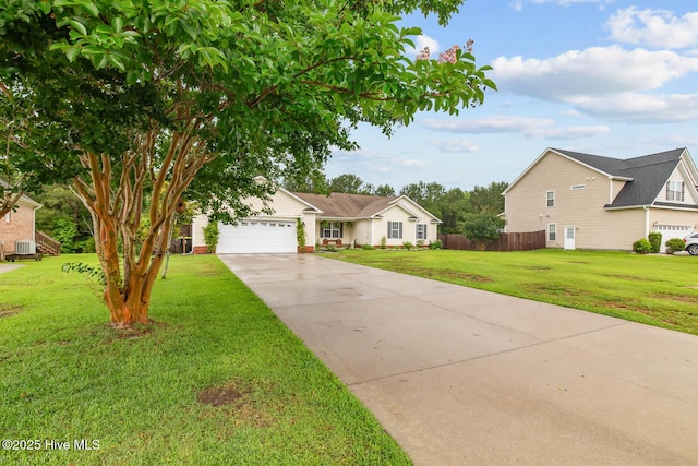 912 Morganser Dr, Swansboro, NC 28584 - view of front of home with concrete driveway, a garage, and central air condition unit