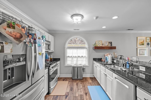 912 Morganser Dr, Swansboro, NC 28584 - kitchen featuring appliances with stainless steel finishes, a sink, open shelves, white cabinets, and crown molding