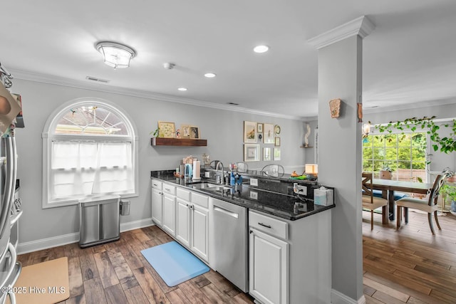 912 Morganser Dr, Swansboro, NC 28584 - kitchen featuring dishwasher, a sink, white cabinets, dark wood-style flooring, and ornamental molding