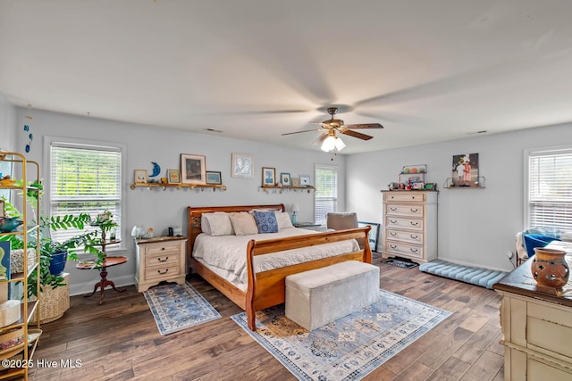 912 Morganser Dr, Swansboro, NC 28584 - bedroom with multiple windows, wood finished floors, baseboards, and a ceiling fan