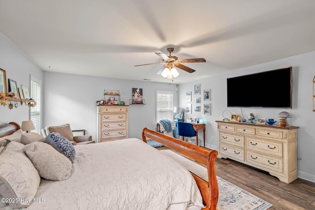 912 Morganser Dr, Swansboro, NC 28584 - bedroom with dark wood-style flooring, ceiling fan, and baseboards