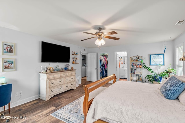 912 Morganser Dr, Swansboro, NC 28584 - bedroom featuring wood finished floors, baseboards, a walk in closet, ceiling fan, and connected bathroom