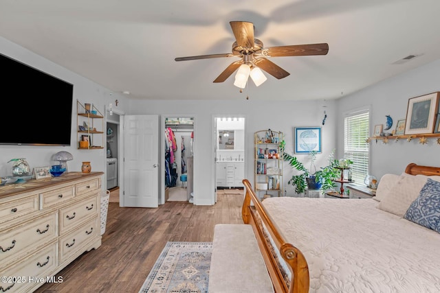 912 Morganser Dr, Swansboro, NC 28584 - bedroom with wood finished floors, a ceiling fan, ensuite bath, and a spacious closet