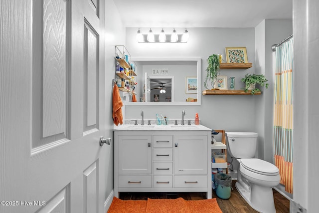912 Morganser Dr, Swansboro, NC 28584 - bathroom featuring toilet, double vanity, and wood finished floors