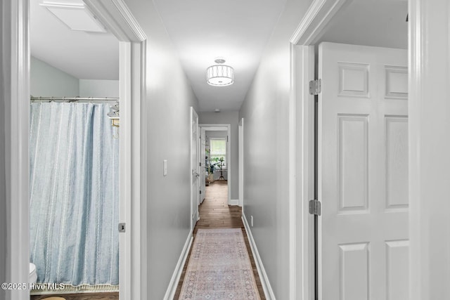 912 Morganser Dr, Swansboro, NC 28584 - hallway featuring baseboards and wood finished floors