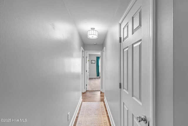 912 Morganser Dr, Swansboro, NC 28584 - hallway featuring wood finished floors and baseboards