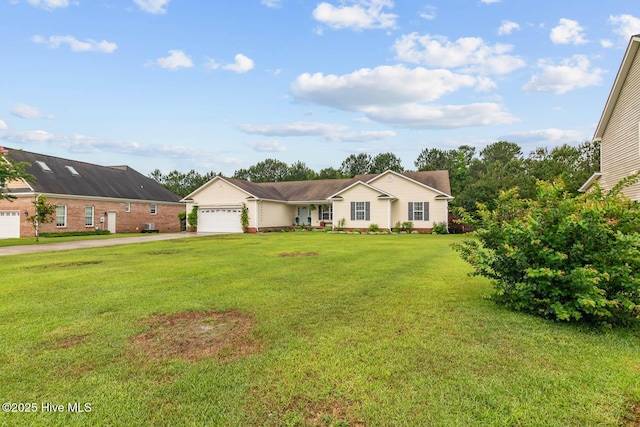 912 Morganser Dr, Swansboro, NC 28584 - ranch-style house with concrete driveway, an attached garage, and a front yard