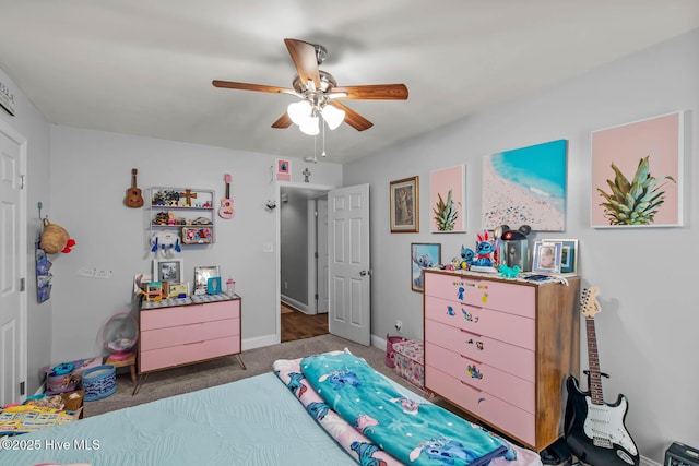 912 Morganser Dr, Swansboro, NC 28584 - carpeted bedroom with baseboards and ceiling fan