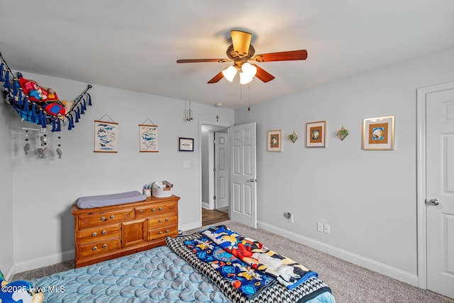 912 Morganser Dr, Swansboro, NC 28584 - bedroom featuring baseboards, carpet, and a ceiling fan