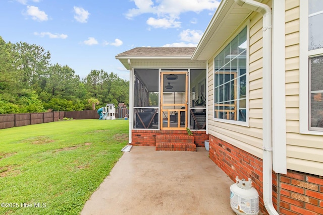912 Morganser Dr, Swansboro, NC 28584 - view of yard featuring a sunroom, a patio, a playground, and entry steps
