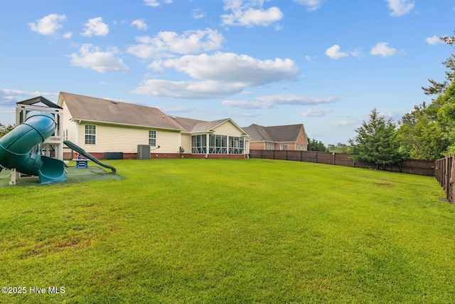 912 Morganser Dr, Swansboro, NC 28584 - view of yard with a playground, a sunroom, and central AC