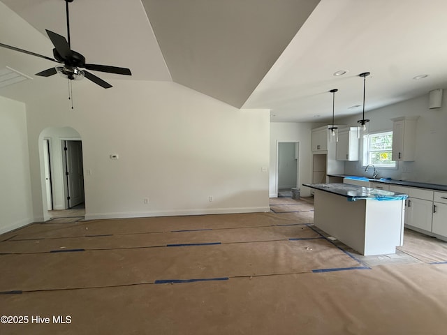 255 Atkins Rd, Cameron, NC 28326 - kitchen featuring a center island, white cabinetry, a ceiling fan, pendant lighting, and dark countertops