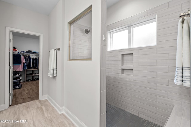 106 Josephs Pt, West End, NC 27376 - full bath with walk in shower, a walk in closet, and baseboards
