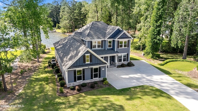 106 Josephs Pt, West End, NC 27376 - craftsman inspired home featuring a shingled roof, board and batten siding, concrete driveway, and a front lawn