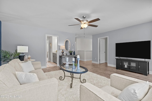 106 Josephs Pt, West End, NC 27376 - living area with wood finished floors, a ceiling fan, and baseboards