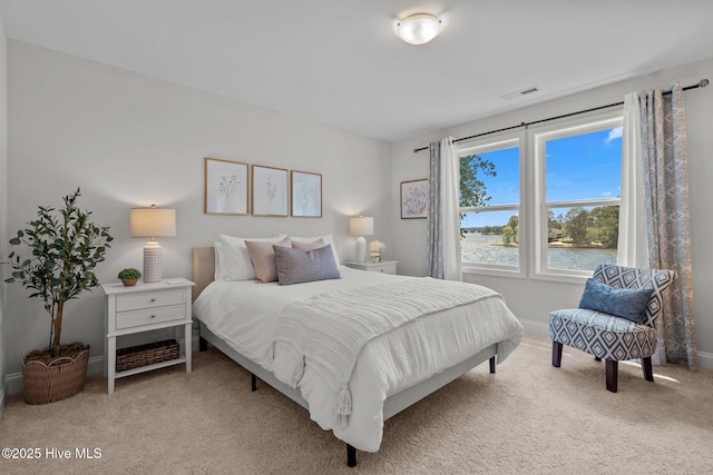 106 Josephs Pt, West End, NC 27376 - bedroom with carpet, a water view, and baseboards