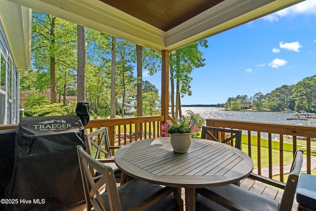 106 Josephs Pt, West End, NC 27376 - wooden terrace featuring a water view and outdoor dining space