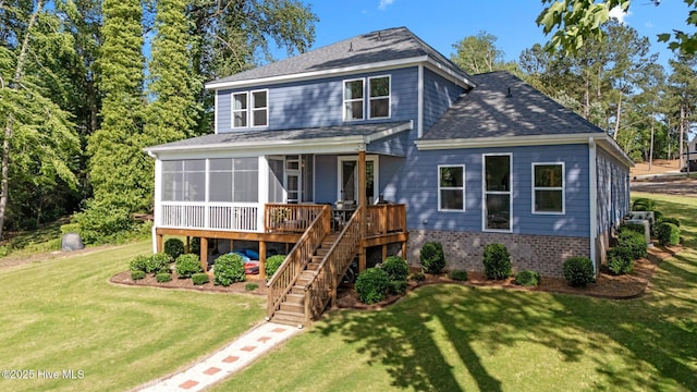 106 Josephs Pt, West End, NC 27376 - view of front facade featuring a front lawn, a shingled roof, a sunroom, stairs, and brick siding