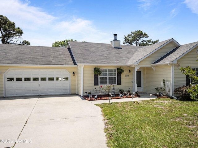 500 Nutfield Dr, Hubert, NC 28539 - view of front of house with concrete driveway, a front yard, a chimney, an attached garage, and roof with shingles