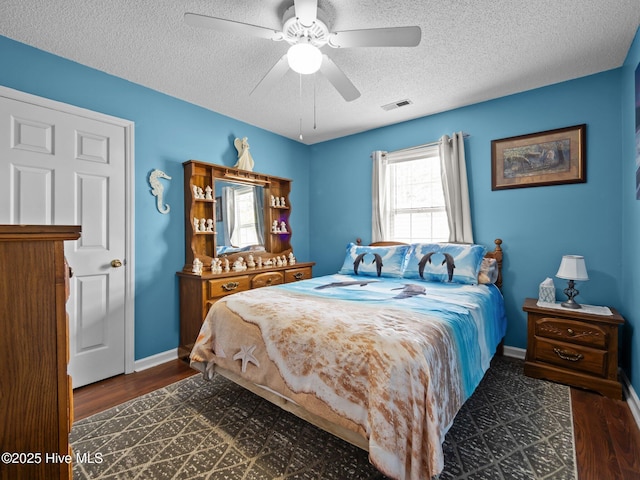 500 Nutfield Dr, Hubert, NC 28539 - bedroom featuring a textured ceiling, baseboards, wood finished floors, and ceiling fan