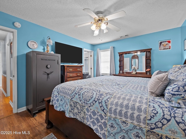 500 Nutfield Dr, Hubert, NC 28539 - bedroom with a textured ceiling, wood finished floors, and ceiling fan