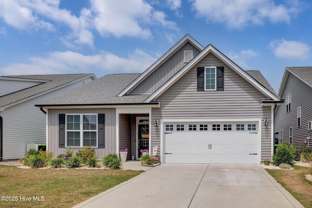 5920 Appomattox Dr, Wilmington, NC 28409 - traditional home featuring board and batten siding, driveway, roof with shingles, and a front yard