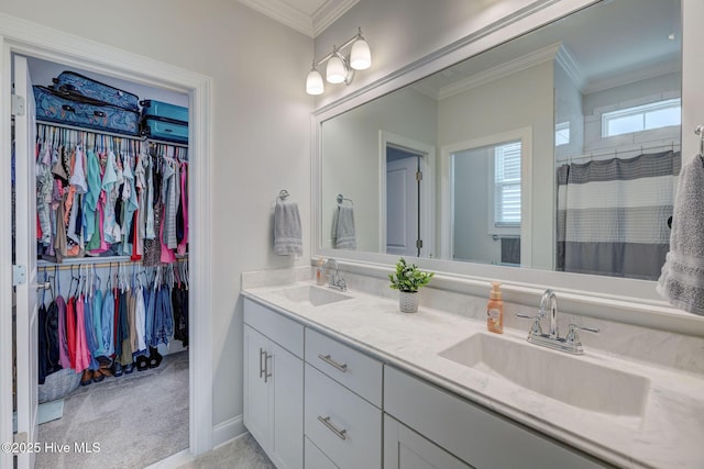 5920 Appomattox Dr, Wilmington, NC 28409 - bathroom featuring double vanity, crown molding, a spacious closet, and a shower with shower curtain