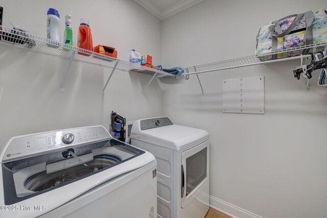 5920 Appomattox Dr, Wilmington, NC 28409 - laundry room with washing machine and dryer, ornamental molding, and baseboards