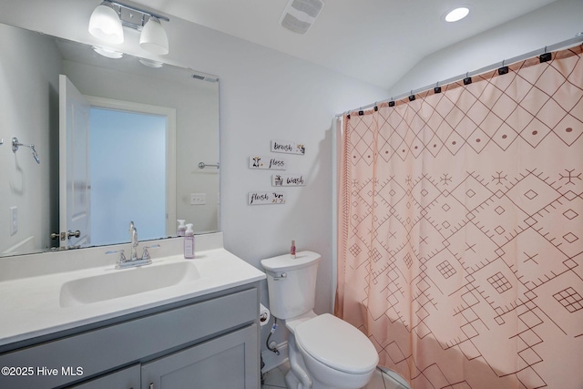 5920 Appomattox Dr, Wilmington, NC 28409 - bathroom with vanity, toilet, a shower with curtain, vaulted ceiling, and recessed lighting