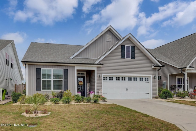 5920 Appomattox Dr, Wilmington, NC 28409 - traditional-style home with board and batten siding, driveway, a garage, a front lawn, and roof with shingles