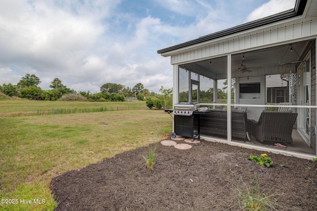 5920 Appomattox Dr, Wilmington, NC 28409 - view of green lawn featuring a ceiling fan and a sunroom