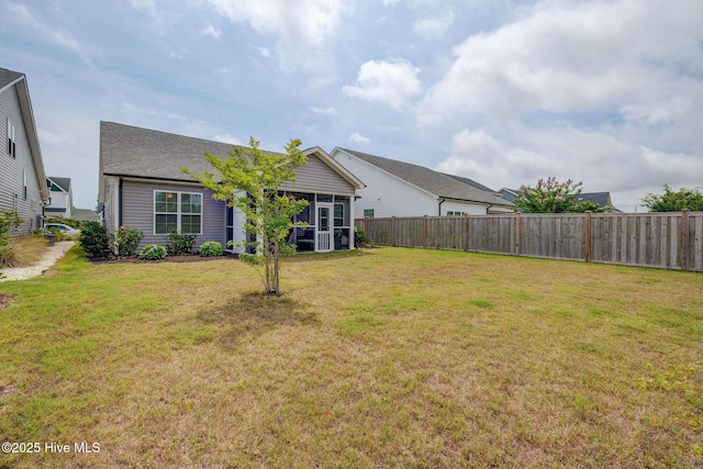 5920 Appomattox Dr, Wilmington, NC 28409 - back of property featuring a sunroom and roof with shingles